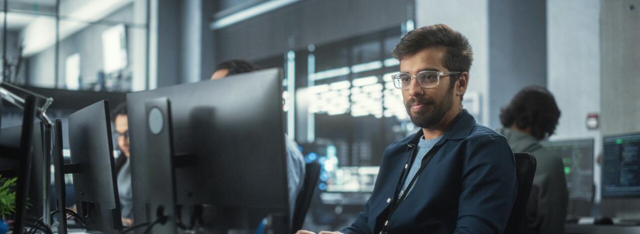 Professional Man Typing Monitor