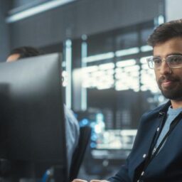 Professional Man Typing Monitor